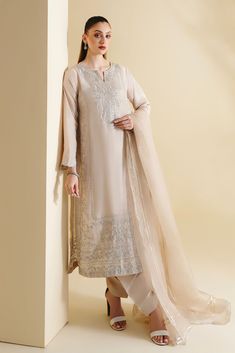 A beautiful pure light beige raw silk ' Zarlasht ' is heavily embellished with zari and sequins. This elegant three piece is perfect for all your festive occasions. The length of the Kameez is 47 inches. Order Duration: 4 to 6 weeks Raw Silk, Three Piece, Light Beige, Festival, Silk, Pure Products, Dresses, Clothes