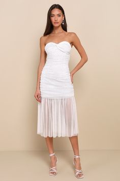 You'll catch everyone's eye when you strut your stuff in the Lulus Sparkling Babe White Mesh Rhinestone Ruched Strapless Midi Dress! Sheer mesh knit, adorned with sparkling rhinestone details, shapes this party-ready dress with a strapless, sweetheart neckline (with hidden no-slip strips) and a twist-front bodice. Flattering ruching throughout emphasizes the figure-hugging silhouette as it continues into a bodycon skirt that ends at a sheer, ruffled midi hem. Hidden back zipper/clasp. Fit: This garment fits true to size. Length: Above mid-thigh. Size medium measures 38.5" from top to bottom. Bust: Great for any cup size. Waist: Fitted - stretchy fabric allows custom fit. Hip: Fitted - stretchy fabric allows room for hips. Undergarments: May be worn with a strapless bra, adhesive bra, petal Hugging Silhouette, Lulu Fashion, Strapless Midi Dress, Adhesive Bra, Bodycon Skirt, Sparkle Dress, White Mesh, Body Con Skirt, Twist Front