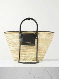 Whether you're heading to the beach or perusing your local farmer's market, Jacquemus' 'Le Panier Soli' tote is sized to carry everything you need. Handwoven from raffia and trimmed with black leather, it has two structured handles and shoulder straps, which can be tucked inside when you're not using it. Designer Straw Bag For Summer, Designer Straw Bag For Summer Shopping, Designer Summer Straw Shopping Bag, Designer Straw Bag For Vacation, Designer Summer Straw Bag, Designer Summer Straw Bag For Shopping, Designer Natural Straw Bag For Summer, Designer Beige Straw Beach Bag, Designer Beige Straw Bag For Beach