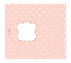 a pink and white polka dot pattern with a blank label in the middle on it