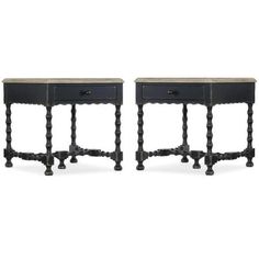 a pair of black nightstands with marble top and legs, each side by side