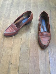 "1970s women's loafers label- Wild Pair brown leather rubber sole moc toe made in Brazil good vintage condition w/age wear fade, scuffs, fray, nicks (esp. to heel backs) label size 7 B measures, insole-9 3/8\" sole-9 1/2\" width-3 1/4\" heel-1\" total height-3 1/2\"" Womens Loafers, 1970s Women, Womens Shoe, Cocktail Dress Vintage, Vintage Cocktail, Women's Loafers, Made In Brazil, 1950s Vintage, Penny Loafers