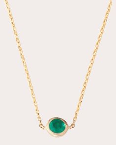 A minimal everyday piece, this 18-karat gold necklace displays a round-cut emerald pendant set in a button-inspired bezel. The enviable green gemstone is long believed to carry energizing properties. Clasp closure 18k yellow gold and emerald Carat: 0.26 ctw Polish with soft cloth Made in Thailand Measurements Chain length: 15in Pendant diameter: 0.19in (4.8mm) Yi Collection, Emerald Pendant Set, Button Pendant, Gold And Emerald, Necklace Displays, Emerald Pendant, Green Gemstones, Pendant Set, Chain Lengths