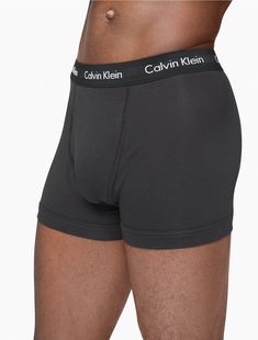 A Calvin Klein icon. The essential designer trunk reinvented in extra-soft cotton stretch. Made with wicking to keep you cool and dry. Designed with the original Calvin Klein logo waistband, this is a sporty look that feels sexy everyday. With a functional fly, supportive pouch and more coverage than our hip brief, this style is easy under anything.  Material: 95% Cotton, 5% Elastane. Face References, Sporty Look, Keep Your Cool, Trunk, Calvin Klein, Pouch, Womens Shorts, The Originals