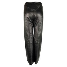 Presenting a pair of black leather Gianni Versace pants, designed by Donatella Versace. From the early 2000s, these black leather pants are accentuated by a front pleat on each leg and a flattering high waist. Enhance your collection with these iconic pants that harmonize luxury and style. Approximate measurements: Size - 42IT Waist: 26-28" Hips: 34" Inseam: 28" 100% Leather Versace Donatella, Leather Wide Leg Pants, Versace Pants, The Early 2000s, Black Leather Pants, Donatella Versace, Pantalon Large, Gianni Versace, Early 2000s