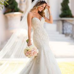 a woman in a wedding dress holding a bouquet