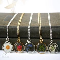 "Our Large Round Pendant is minimal and classic. Available in 24k gold plated or .999 sterling silver plated and in a variety of real preserved botanicals.  Choose from 24k gold plated or .999 sterling silver plated. The Dandelion Seed symbolizes wishes. The Fern is a symbol of sincerity Daisy is a symbol of hope.  Forget-me-nots are known as a symbol of lasting friendship, love, and remembrance   Thyme is a symbol of courage. Pendant hangs from a gold or silver plated chain, available in 26\" o Rose Gold Flower Pendant Necklace Nature-inspired, Rose Gold Flower Pendant Necklace, Nature-inspired, Rose Gold Nature-inspired Flower Pendant Necklace, Dainty Birth Flower Round Pendant Jewelry, Minimalist Birth Flower Jewelry Keepsake, Gold Sterling Silver Necklaces With Pressed Flowers, Gold Sterling Silver Necklace With Pressed Flowers, Brass Jewelry With Birth Flower For Gift, Botanical Sterling Silver Jewelry Gift