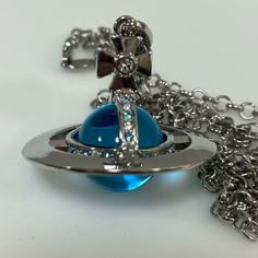 It is an orb necklace by Vivienne. Color: Sky Blue. And we do not investigate the state of the inside of the watch. Vivian Westwood Necklace, Vivian Westwood, Vivienne Westwood Necklace, Westwood Necklace, Orb Necklace, Saturn Necklace, Vivienne Westwood Jewellery, Dope Jewelry, Classy Jewelry