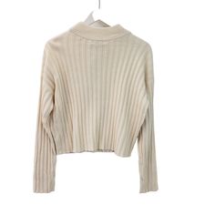 Beautiful cream color ribbed mock cropped sweater that is a great piece to wear alone or layer with a button down shirt underneath. Nice career piece or wear for a more casual day. NOTE that preloved pieces may have changed in size with wash and wear so please check approximate measurements for current size and fit.Size: Womens MApproximate Measurements Lying Flat: Bust 19.5 in Waist 19 in Length 19.5 inCondition: New With TagsAll pieces are stored in a smoke-free, pet-free environment. If flaws Cropped Sweater, Cream Color, Madewell, Sweater Sizes, Wool Blend, Button Down Shirt, Career, Size Medium, Pet