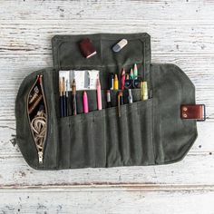 a pencil case filled with lots of pens and markers