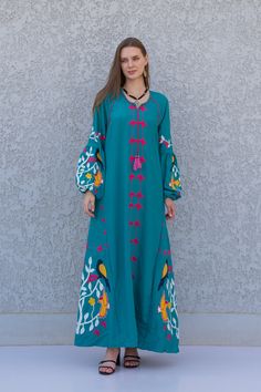 "A stunning embroidered Kaftan dress that is elegant, colorful, and unique! The dress is made of Egyptian cotton that has a soft feel to it so you will surely feel comfortable and royal in it. It also comes with a small invisible pocket on the right side of the Kaftan for added practicality.  You can wear this Kaftan practically anywhere and for any occasion. You can dress it up with a pair of heels and strut like an Egyptian queen in any gathering, resort, or party. Or you can dress it down wit Green Embroidered Floor-length Maxi Dress, Embroidered Green Floor-length Maxi Dress, Eid Multicolor Embroidered Maxi Dress, Traditional Embroidered Maxi Dress For Spring, Spring Long Abaya With Floral Embroidery, Spring Abaya With Floral Embroidery, Spring Floral Embroidered Long Abaya, Spring Floral Embroidered Abaya, Bohemian Green Maxi Dress With Floral Embroidery