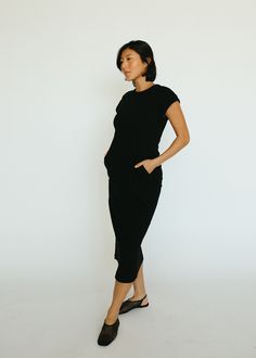 Simple but stylish, classic and cool - The Origin Dress is a timeless, ribbed midi dress that you can throw on with ease. Wear it casually, add a jacket or dress it up, The Origin Dress can do it all. Fitted Solid Midi Dress For Loungewear, Black Midi Dress With Relaxed Fit, Ribbed Stretch Midi Dress For Work, Stretch Ribbed Midi Dress For Work, Sleek Ribbed Midi Dress, Versatile Fitted Midi Dress For Work, Casual Midi Length Dress For Business, Black Relaxed Fit Dress For Everyday, Black Relaxed Fit Midi Dress