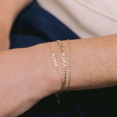 Celebrate love and motherhood with the charming Tiny Gold MAMA Bracelet. Available in 14K Yellow Gold Chain length = 6"-7" adjustable Letters = 3.5mm tall MAMA = 16mm across Adjustable Everyday Gold Bracelet For Mother's Day, Adjustable Hypoallergenic Bracelet In 14k Gold, Adjustable Hypoallergenic Bracelets In 14k Gold, Hypoallergenic Adjustable Bracelets In 14k Gold, Adjustable Hypoallergenic 14k Gold Bracelet, Engraved Bracelet As A Gift For Mom, Engraved Bracelet Gift For Mom, Adjustable 14k Gold Jubilee Charm Bracelet, Adjustable Yellow Gold Name Jewelry