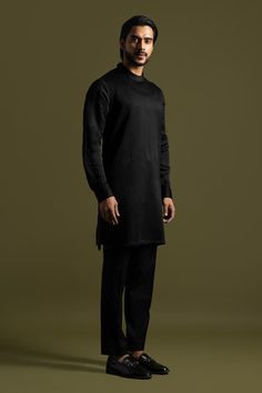 Black full sleeves round collar kurta with all over linear stitch line embroidery and pintucks detail on one side. Paired with a trouser. - Aza Fashions Eid Straight Kurta With Set-in Sleeves, Traditional Workwear Sets For Fall, Fitted Kurta For Workwear In Fall, Designer Straight Kurta For Fall, Fitted Kurta With Set-in Sleeves For Eid, Long Sleeve Chikankari Kurta For Work, Traditional Long Sleeve Sets For Workwear, Designer Cotton Bandhgala With Long Sleeves, Fitted Long Sleeve Kurta For Workwear