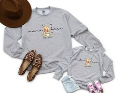 Personalized Mama Bear Daddy Bear Sweatshirt, Baby Bear Youth Sweatshirt, Personalized Hoodie, Family Bear Matching Shirt, Family Sweatshirt Hello Everyone! Welcome to NewTeeApparel. We are thrilled to have you here at our shop. At NewTeeApparel, you will find an extensive array of affordable, top-quality personalized designs and one-of-a-kind creations perfect for surprising your friends, family, coworkers, and loved ones. Our prints are meticulously crafted using the latest cutting-edge materi Sister Bear, Bear Sweatshirt, Gildan Sweatshirts, Personalized Hoodies, Branded Sweatshirts, Baby Bear, Mama Bear, Matching Shirts, Types Of Shirts