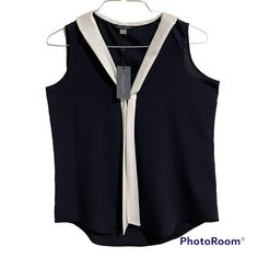 Tommy Hilfiger Womens Sleeveless V-Neck Shirt With Sailor Tie Front. Dress Shirt. Navy Blue With White Tie. Please See Photos Above For Measurements. Size: Medium I Always Carefully Package And Ship Out Immediately. Please Check Out Our Other Listing. New Items Posted Daily. Casual V-neck Tank Top For Work, Elegant Blue V-neck Vest, Summer V-neck Workwear Vest, Casual V-neck Vest Blouse, Summer Workwear Tank Vest, Elegant Blue V-neck Tank Top, V-neck Blouse With Vest For Work, Sleeveless Blue Blouse For Work, Blue Sleeveless Tank Top For Work