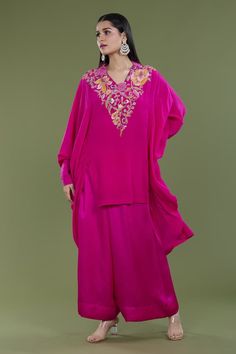 Rani pink high low kaftan with french knots, thread embroidery in floral pattern on neckline. Paired with pant. - Aza Fashions Pink Kaftan With Dabka Work For Wedding, Pink Floor-length Festive Kaftan, Pink Wedding Kaftan With Dabka Work, Traditional Pink Georgette Kaftan, Pink Silk Kaftan With Dabka Work, Pink Embroidered Floor-length Kaftan, Traditional Pink Kaftan With Resham Embroidery, Embroidered Pink Floor-length Kaftan, Pink Resham Embroidery Kaftan For Eid