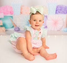 Perfect for an ice cream themed birthday!  With ruffled shoulders and ruffles on the bottom, this is the most darling little sunsuit ever! Made of a pretty pastel pink seersucker with soft mint green seersucker ruffles, it is cool and sweet for a summer  party.  Available with numbers 1-4.  Choose from ruffled shoulder straps that tie in the back with a bow, or that button at the waistband. Shoulders straps can have no ruffles, a single layer of ruffles, or a double layer of ruffles.  Available in sizes:  newborn- 3 months 3-6 months 6-9 months 9-12 months 12-18 months 18-24 months 2T 3T 4T Hand made in my smoke free, cat friendly, child friendly home. Green Ruffled Bubble Romper For Playtime, Green Bubble Romper With Ruffles For Playtime, Playful Pink Bubble Romper For Cake Smash, Cute Pink Bubble Romper For Cake Smash, Cute Pink Bubble Romper For Birthday, Cute Green Bubble Romper With Ruffles, First Birthday Sleeveless Bubble Romper With Ruffles, Sweet Pink Bubble Romper For Birthday, Pink Ruffled Bubble Romper For First Birthday