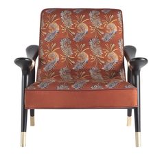 an orange chair with two black legs and a floral pattern on the armrests