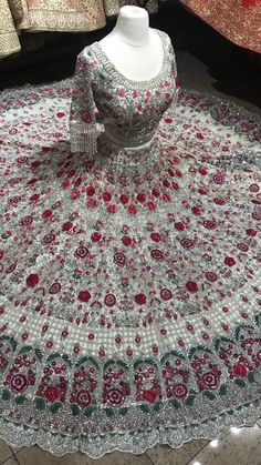 This glimmering white craftsmanship with fine details of multicolor resham thread, sequins, stone, pearl and cutdana nestled on sheer net fabric in floral embroidery bloom this lehenga. Includes a ready similarly embroidered with hanging tassel blouse paired with beautiful net dupatta. If you are planning to ace the grace of your D-day dress, then this white is the best choice. Fabric: Net Custom designed according to client measurements and color preference. Production and delivery time is 120 Tassel Blouse, Net Fabric, Net Dupatta, Floral Embroidery, Day Dresses, Lehenga, Thread, Custom Design, Embroidery