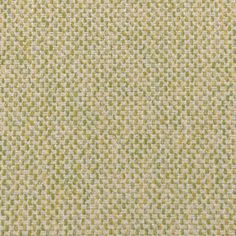 an upholstered green and white fabric textured with small dots on the surface