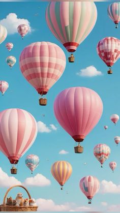 many hot air balloons flying in the sky