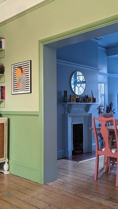 a living room filled with furniture and a clock on the wall