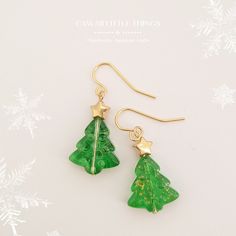 - Please read the full description below - Christmas tree earrings  ------------------------------------------------------------------- I am trying to capture the colours of the items as best as possible,  however, colours may vary slightly due to lighting conditions. -------------------------------------------------------------------- - Details - - Sold as a pair : Quantity 1 = 1 pair of earrings - Christmas tree - Glass beads *Closure* - Hooks - Surgical stainless steel 316L (Nickel free)  *Hy Handmade Jewelry For Christmas Celebration, Festive Christmas Jewelry With Matching Earrings, Christmas Celebration Jewelry With Matching Earrings, Elegant Green Earrings For Christmas, Christmas Jewelry Gift With Matching Earrings, Handmade Festive Earrings For Christmas, Christmas Dangle Jewelry For Celebration, Handmade Christmas Earrings For Celebration, Handmade Gold Christmas Earrings