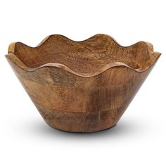 a wooden bowl sitting on top of a white surface