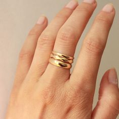 A simple 2mm gold band crafted in 14k yellow gold, for all your stacking needs. Wear it solo, as a simple vow ring, or stacked playfully with our other gold ring options. Either way, you can't go wrong. This style is made to order and will take 2-3 weeks to ship. Crafted in San Francisco using ethically sourced materials. *All sales are final* Everyday 14k Gold Stackable Rings Fine Jewelry, Everyday 14k Gold Fine Jewelry Stackable Rings, Everyday Fine Jewelry: 14k Gold Stackable Rings, Everyday 14k Gold Stackable Rings, Adjustable Thick Band 14k Gold Rings, 14k Rose Gold Midi Rings With Round Band, Minimalist Stacked Midi Rings As Gift, Modern 14k Gold Filled Stackable Rings, Stackable Yellow Gold Jewelry With Modern Twist