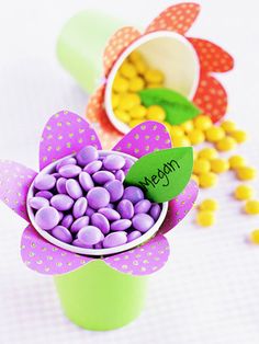 a cup filled with candy sitting on top of a table