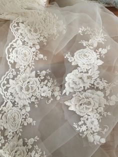 the white lace is on top of sheer fabric, and it looks like something else