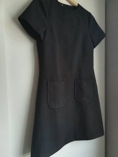 Made under request! Handmade dress in soft wool with lining 90%polyester 2%elastan 8%viscose Color: Black You can see here an example on a coat from the fabric https://www.etsy.com/listing/206734254/mod-wool-coat-60s-retro-soft-light-blue?ref=shop_home_active_1 You can choose your own measurements, length. Special request are easy, just add this listing to your cart https://www.etsy.com/listing/624364219/special-requests?ref=shop_home_active_25 If you want it on a rush you have priority shipping Classic Wool A-line Dress, Retro A-line Mini Dress For Work, A-line Office Dress With Pockets, Formal Fitted Wool Dresses, Fitted Wool Formal Dress, Fitted Wool Dresses For Formal Occasions, Short Sleeve Dress With French Seams For Work, Workwear Dresses With French Seams And Short Sleeves, Elegant Fitted Dresses With Pockets