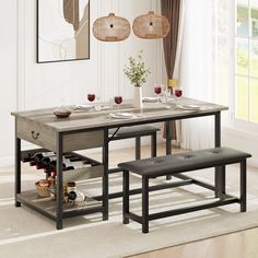 a dining room table with two benches and wine glasses on it in front of a window