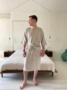 "Cozy Bathrobe, a unisex kimono linen robe for ultimate relaxation. Made from breathable linen, ideal for home lounging or as a post-bath wrap. Offers warmth and comfort with below-the-knee length, 3/4 sleeves, shawl collar, and belt. Features two pockets for convenience. A perfect gift to elevate any at-home collection. Specifications: ∙ Model: 178 cm/5'10\" (M, Natural) ∙ Length: 115 cm / 45.2\" ∙ Below-the-Knee length ∙ 3/4 sleeves ∙ Shawl collar ∙ Includes a belt with loops ∙ Two pockets ∙ O Mens Lightweight Cotton Rustic Robes, Casual Robe For Relaxation, Casual Linen Kimono For Loungewear, Casual Linen Kimono With Relaxed Fit, Relaxed Fit Linen Sleep Robe, Relaxed Fit Linen Robe For Home, Linen Bathrobe, Summer Lounge, Linen Robe