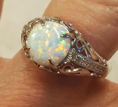 Wonderful White Fire Opal Vintage Style Ring, 8mm Favorite Lab Created Fire Opal, See Video For Rainbow Fire! 925 Sterling Silver Vintage Style Ring With Tiny Cubic Zirconia Trim. Gift Box Included. Silver Opal Ring With Diamond Accents, Classic Silver Opal Ring With Accent Stones, Rainbow Fire, Vintage Style Rings, See Videos, Cute Jewelry, Fire Opal, Statement Rings, Cubic Zirconia