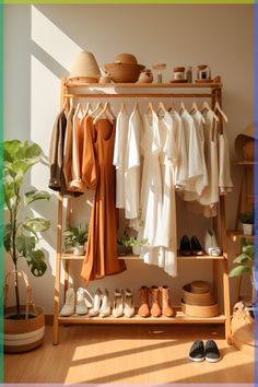 an open closet with clothes and shoes hanging on the rack next to a potted plant