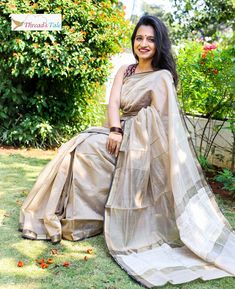 This summery Beige handwoven Maheshwari Saree apt for all occasions. Light and breathable fabric Made with Silk and Mercerized Cotton with contrast border .And jute at the corner. Blouse part of length of saree. Blouse worn by model is not included. 5.5 metres. Dry cleaning only. Unstitched Chanderi Saree For Summer, Summer Chanderi Saree With Pallu, Summer Unstitched Chanderi Saree, Wedding Saree In Cotton Silk With Weaving Work, Traditional Summer Pre-draped Saree With Zari Work, Unstitched Saree With Pallu For Summer, Summer Pallu Saree Unstitched, Summer Anarkali Saree With Cutdana, Traditional Art Silk Saree For Summer