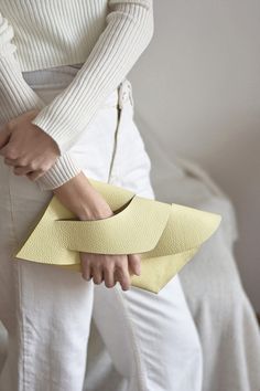 Customizable with a message and gift wrapped, the versatile Balance Clutch Purse is handmade in premium Italian cowhide with unique wrist handle design. A signature style from our 2020 Balance collection, it is handcrafted with a clean and minimal design, finished with handpainted edges, it comes with a possible monogram, name or your custom text), a smooth leather lining and gift wrapped in a 100% cotton dust bag with the LINDASIETO brand logo print. Outer: 100% Italian Cowhide Inner: 100% Ital Modern Envelope Bag For Gifts, Modern Envelope Bag As Gift, Modern Yellow Bags Perfect For Gifts, Modern Yellow Bags For Gifts, Cream Rectangular Clutch For Gift, Modern Yellow Bag As A Gift, Modern Cream Bag For Gift, Modern Pouch Clutch As Gift, Yellow Rectangular Clutch For Gift