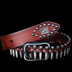 Rock 'n reload When you're shooting for that outlaw bandit look, it's time to rock this genuine leather belt that looks like a bandolier loaded with bullets.It comes in four colors and three sizes, and is also studded with skull and crossbones, and a design featuring a gun in front of a row of bullets.The buckle and bullets are metal alloy, and the belt is 3.8 cm (1.18 in.) wide.Rock it and you'll never run out of ammo, or have to ask yourself "did I fire six shots or only five?" Plays well with Bullet Belt, Belt Collection, Distressed Leather Belt, 80s Rock, Western Buckles, Vintage Leather Belts, Western Belt Buckles, Rock Outfits, Metal Belt