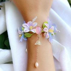 Introducing our Chinese vintage style flower bracelet that's made in silk. Originated from the traditional Chinese Hanfu accessories, the entire bracelet, including the band and the flowers are delicately embroidered with high quality silk. The elegant morning glory and lily of the valley design makes the bracelet so unique and elegant, with the pearls together give the jewelry a fresh and unique feeling. ✈️ Handling & Shipping usually takes about 10 days in total, so please consider the process Handmade Bracelets For Wedding In Spring, Handmade Bracelets For Spring Weddings, Lily Of The Valley Design, Lunar New Year Gift, Hanfu Accessories, Traditional Chinese Hanfu, Chinese Embroidered, Chinese Vintage, Silk Jewelry