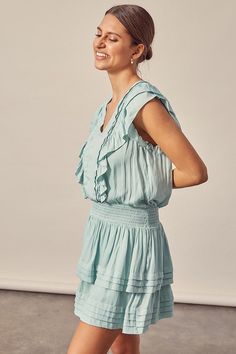 Introducing our Pleated Detail Dress, a charming and stylish addition to your wardrobe. This dress features a smocked waistband that adds comfort and a flattering fit. The pleated skirt creates a graceful and elegant look, while the ruffle detailing adds a touch of whimsy and playfulness to the design. With its versatile and fashionable design, it's perfect for a variety of occasions. Size + Fit - Model is wearing size S- Measurements taken from size S- 5'9" / 175CM- 32-24-34 Style: Boho Print / Chic Sleeveless Smocked Top With Elastic Waistband, Chic Smocked Sleeveless Top With Elastic Waistband, Chic V-neck Smocked Dress With Ruffles, Chic V-neck Smocked Top With Ruffles, Chic Pleated Waist Dress For Day Out, Casual Ruched Ruffle Dress For Brunch, Daywear Dresses With Pleated Waist And Flowy Skirt, Chic Tiered Smocked Dress, Elegant Mini Dress With Smocked Bodice For Day Out