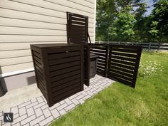 an outdoor patio area with two chairs and a trash can