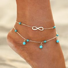 Stylish infinity double anklet with blue drop beads Great to wear as foot jewelry, or as beach wedding footwear The blue beads makes it a great Something Blue The infinity sign represents forever, so it will make a great gift for Bridesmaids, Girlfriend, Daughter, Wife, Sister and more Packaged in a jewelry bag Available in silver and gold Leg Jewelry, Foot Chain, Beautiful Anklet, Foot Bracelet, Summer Bracelet, Ankle Jewelry, Anklets Boho, Beach Anklets, Women Anklets