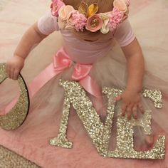 This one sign in glitter says "ONE" and is perfect for your little one's first birthday, whether on display at the party or used for a photo shoot! Cut in wood and glittered in your choice color, this wooden letters decoration is sure to bring smiles to everyone's faces!SIZE: 8" tall and spans about 20" wide (this item is NOT freestanding) Please specify the date needed by in the "note to seller" at checkout.ADD A PROP! - Birthday Photo Props Are Here: www.etsy.com/listing/188770851See Our Line Pink Bday, Letters Decoration, Princess Birthday Decorations, First Birthday Sign, 1st Birthday Pictures, First Birthday Pictures, Birthday Photo Props, 1st Birthday Photos