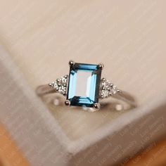 London blue topaz ring emerald cut white gold engagement | Etsy Luo Jewelry, London Blue Topaz Engagement Rings, Sky Blue Topaz Ring, Swiss Blue Topaz Ring, Ring Emerald Cut, Blue Topaz Engagement Ring, Blue Gemstone Rings, Engagement Ring For Her, Topaz Engagement Ring