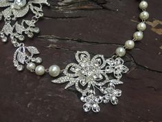 "Perfect for all bridal or party to wear!! Romantic shaped necklace featuring sparkle flower pendants and linked with pearl chains. Color: clear rhinestone crystals with pearls Size: necklace measures around 19.5\" long and large flower pendants around 6\" long x 3.25\" width Item ship out with tracking number to you (around 10 to 14 business days for delivery). We also provide fast shipping service, around 3-4 business days delivery but need to add extra charge. Please convo us if need." Wedding Crystal Necklace With Flower Design, Wedding Crystal Flower Necklace, Flower Crystal Wedding Necklace, Silver Flower Pearl Necklace For Wedding, Necklace Prom, Prom Necklace, Pearl Chains, Prom Necklaces, Romantic Necklace