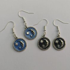 Enamel moon earrings  Available in: * black * blue Silver plated Pendant size: 19x16mm Necklace length: 18 inch / 45cm Matching necklace also available  Complete in gift bag Blue Moon-shaped Sterling Silver Earrings, Blue Alloy Pendant Jewelry, Blue Alloy Earrings For Gift, Trendy Crescent Jewelry Gift, Trendy Silver Enamel Jewelry, Blue Crescent Moon Charm Earrings, Nickel-free Blue Enamel Jewelry, Black Dangle Alloy Earrings, Black Dangle Earrings In Alloy