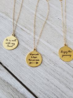 "Lovely inspirational gold necklaces feature laser engraved pendants with beautiful quotes, each one with words of wisdom. They hang from gold filled chain. Pendants measure 20\". Select your desired quote and length from the drop box. All your items will be packaged and shipped in a cotton filled kraft box. ~The best way to prevent tarnish is to wear your jewelry regularly. When not wearing your jewelry, the best way to protect it is to store it in a sealed plastic bag. Humidity, chemicals and Everyday Meaningful Gold Charm Necklace, Gold Meaningful Charm Necklace For Everyday, Meaningful Engraved Charm Necklace For Best Friend, Engraved Meaningful Charm Necklace For Best Friend, Inspirational Personalized Charm Necklace For Best Friend, Personalized Inspirational Charm Necklace For Best Friend, Inspirational Round Pendant Charm Necklace As Gift, Inspirational Gold Jewelry For Gifts, Inspirational Round Pendant Charm Necklace Gift