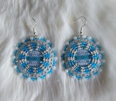 2023 Cool-Toned Collection! Each pair of earrings is unique and one of a kind. This collection features mainly a blue and puple colour palette.  Made by an inspired Indigenous woman NOT indigenous-inspired.  Authentic, First Nations beaded earrings. Beaded earrings make a beautiful gift for someone special or just for yourself! Canadian-made using czech beads, rondelles, iridescent leatherette, and nylon thread. Artisan Blue Round Beaded Earrings, Bohemian Blue Beaded Round Earrings, Blue Beaded Round Crystal Earrings, Unique Blue Beaded Nickel-free Earrings, Unique Blue Beaded Earrings Nickel-free, Blue Beaded Earrings, Rose Gold Accents, Silver Accents, Cool Tones